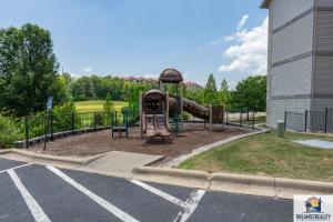 a playground with a slide in a parking lot at 3BR Walk-In - Close to Attractions - FREE TICKETS each day you stay - RL4-2 in Branson