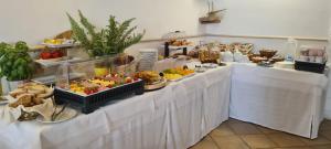 a buffet line with appetizers and food on display at Hotel Punta San Francesco in Vieste