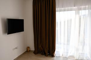 TV a/nebo společenská místnost v ubytování Raj