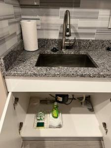 a kitchen counter with a sink and a sink at 502 Luxury 1BR apartment in center city in Philadelphia