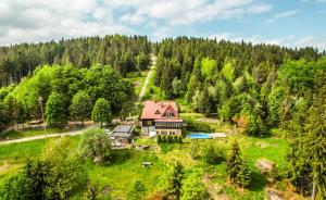 an aerial view of a house in the woods at Horská Chata Gírová in Bukovec