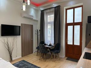 TV a/nebo společenská místnost v ubytování Lizu Apartmant
