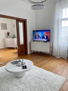 Μια τηλεόραση ή/και κέντρο ψυχαγωγίας στο Nid urbain Colmarien - 4 personnes - garage +12 φωτογραφίες