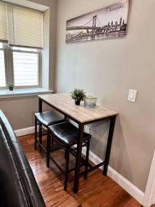 a dining room table with two chairs and a table at 505 Relaxing 1BR apartment in center city of Philly in Philadelphia