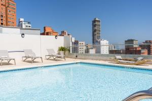 a swimming pool on the roof of a building at Four Points by Sheraton Barranquilla in Barranquilla