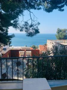 a view of the ocean from a balcony at Райское место in Šušanj