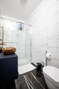 a bathroom with a glass shower and a toilet at Apartment Kamila in Krk