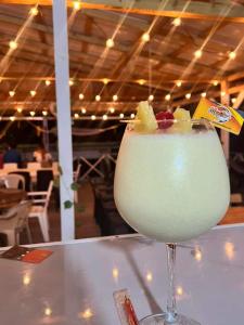 a drink sitting on top of a table at Posada Lia Centro in Providencia