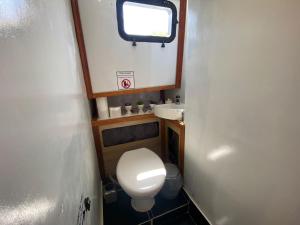 a small bathroom with a toilet and a sink at göcek yat in Fethiye