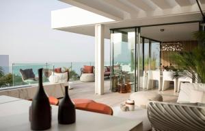a living room with a view of the ocean at Luxury Villa Rebeka - Heated Pool and Jacuzzi in Adeje