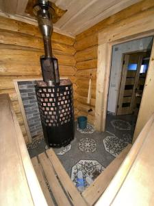 a outside view of a stove in a cabin at Sadyba na Luzi in Verkhne-Studeny