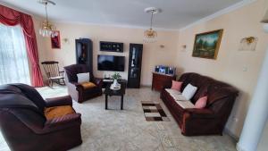A television and/or entertainment centre at Beáta Apartman