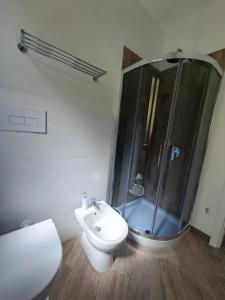 a bathroom with a shower and a toilet and a sink at Suite Da Gabry 2 in Olbia +15 photos
