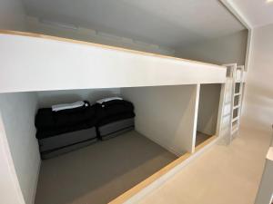 a small closet with a shelf and two towels at THE LAND HOTEL - Vacation STAY 88256v in Arao