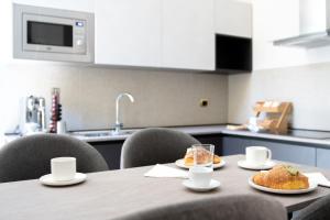 Kuchyň nebo kuchyňský kout v ubytování Lifestyle and Suites