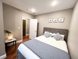 a bedroom with a large bed and a table at 407 Sweetest cottage 1bed room Apt in center city in Philadelphia
