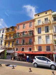 a silver car parked in front of a building at Logement entier 6 pers à 500m de la plage in Sète +37 photos