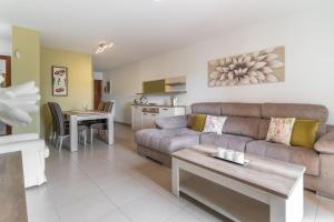 a living room with a couch and a table at CASA ANA in Alcalá