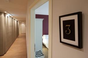 Postel nebo postele na pokoji v ubytování Hotel Leon D'Oro