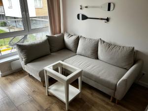 Ein Sitzbereich in der Unterkunft Apartament Szumilas Rowy