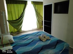 Letto o letti in una camera di HOSPEDAJE YACUCALLE