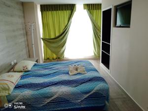 Letto o letti in una camera di HOSPEDAJE YACUCALLE