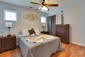 a bedroom with a bed and a ceiling fan at Charlotte Home about 9 Mi to Bank of America Stadium! in Charlotte