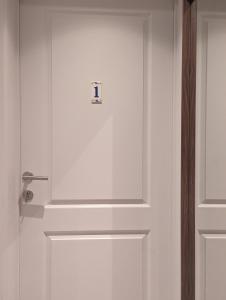 a door with a lock on it in a room at Archimède Suites in Brussels