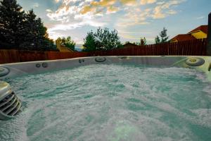 a large pool of water in a backyard at Hillcrest Chalet - Spa - Mountain Views - Fire Pit - Slide -9min to USAFA in Colorado Springs
