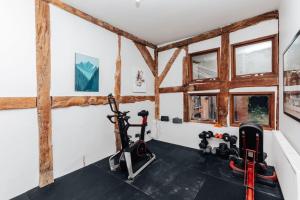 a gym with two exercise bikes in a room at The Lakeside Viewing Gallery in Shiplake