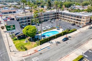 an aerial view of a hotel with a parking lot at Vagabond Inn Whittier in Whittier