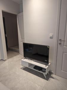 a living room with a flat screen tv on a wall at Archimède Suites in Brussels