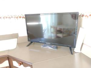 a flat screen tv sitting on top of a table at CASA FRONTE MARE in Ventimiglia