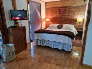 Postel nebo postele na pokoji v ubytování Cabañas Spa Bungalows Huarranchi