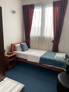 Voodi või voodid majutusasutuse Garni hotel Niksic toas