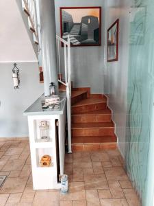 a stairway with a stair case and a stair case at La Villa di Bambi in Vanzago