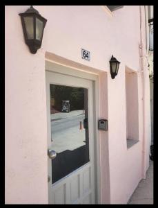 a door to a building with a sign above it at Fortezzino in Rethymno