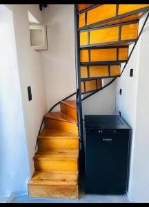 a staircase in a room with a trash can at Fortezzino in Rethymno