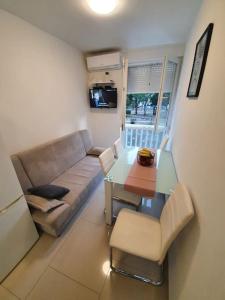 a living room with a couch and a table at Apartman Mila in Split