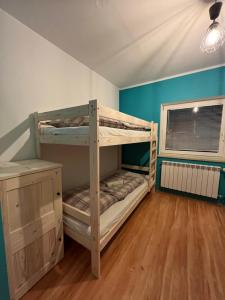 a bunk bed room with two bunk beds in it at Hostel Regionalny in Zakopane