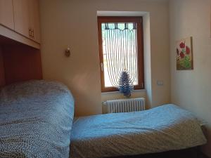 Postel nebo postele na pokoji v ubytování Casa di Ariel