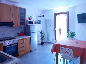Kuchyň nebo kuchyňský kout v ubytování Casa di Ariel + 19 fotografií