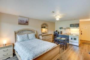 a bedroom with a bed and a small kitchen at Inviting New River Gorge Studio! in Fayetteville