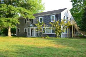 a house with a large yard in front of it at HI - Martha's Vineyard Hostel in Vineyard Haven