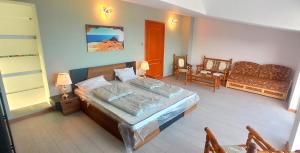 A bed or beds in a room at Arode Villa Dionysus
