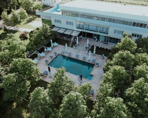 an overhead view of a building with a swimming pool at Hotel La Villa in Gjakove