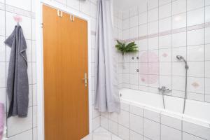 a bathroom with a shower and a tub and a door at House Bany in Skradin +63 photos