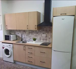 Kuchyň nebo kuchyňský kout v ubytování APARTAMENTO TURISTICO GUADIANA LOFT EXPERIENCE Dalia + 27 fotografií
