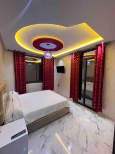 a bedroom with a bed with a marble floor at Selouane in Nador