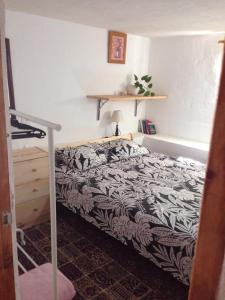 A bed or beds in a room at Half wooden rural apartment